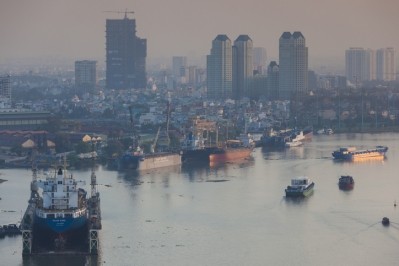 View of Saigon River and shipyard, Ho Chi Minh City © GettyImages/Walter Bibikow