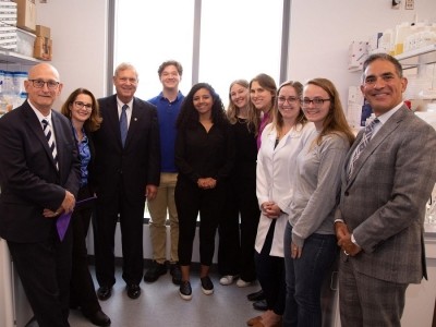 US secretary of agriculture, Tom Vilsack, visited the Ganda Lab in September 2022. Pictured from left: Rick Roush, dean of College of Agricultural Sciences; Erika Ganda; Secretary Vilsack; Joshua Wolff, undergraduate student; Ana Fonseca, graduate student; Sophia Kenney, graduate student; Jennine Lection, graduate student; Emily VanSyoc, graduate student; Stephanie Bierly, laboratory technician; and Justin Schwartz, Penn State executive vice president and provost.  Credit: Michael Houtz/Penn State