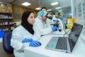 Two KAUST researchers work at the new Saudi Center for Algal Biotechnology Development and Aquaculture. © Kaust 